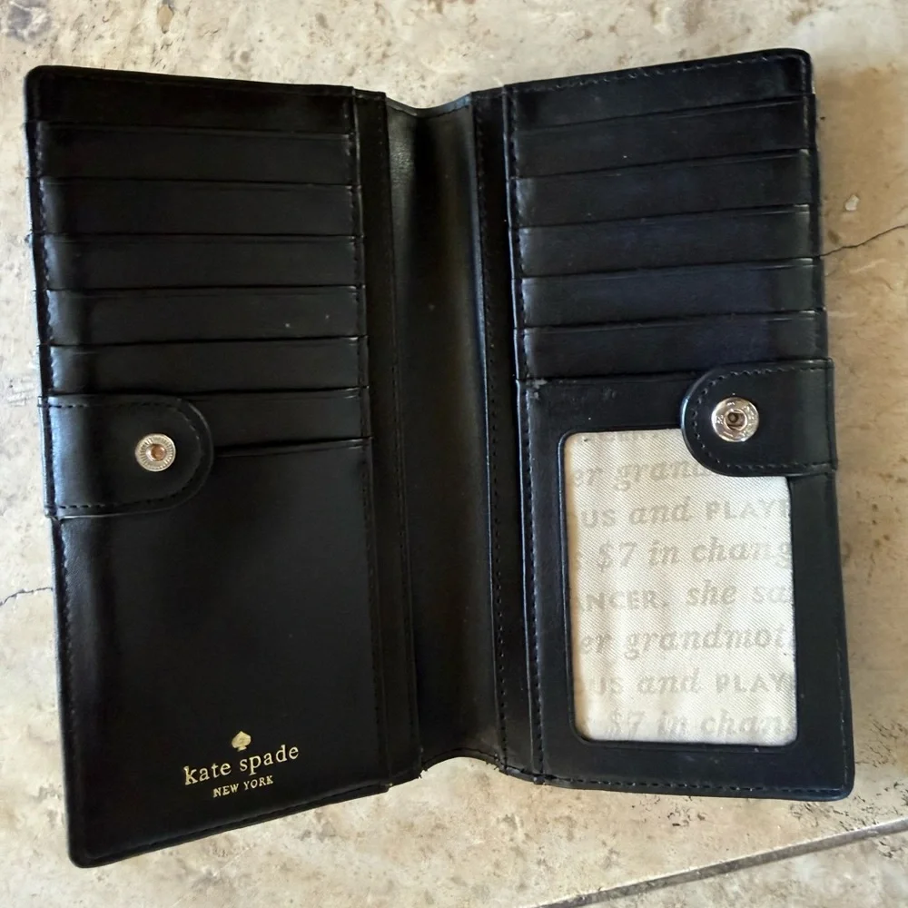 KATE SPADE ladies wallet 3 1/2 x 7” preowned good fair condition, purple black